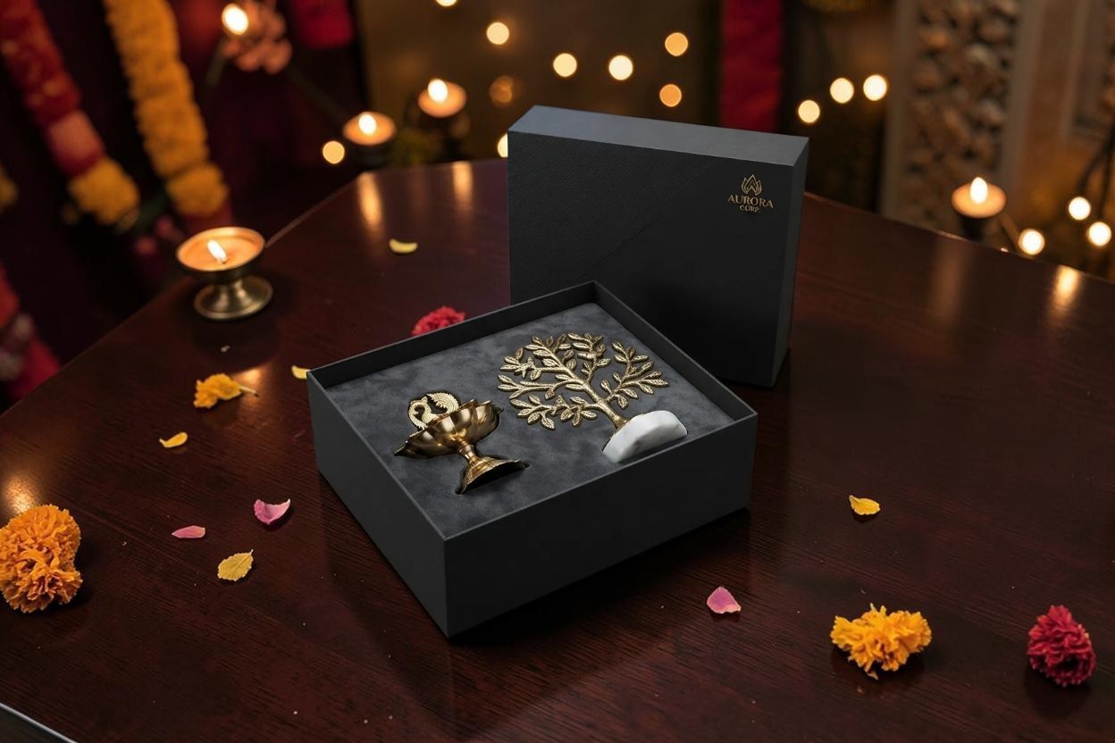Brass decorative tree and peacock diya presented in a black Diwali gift box