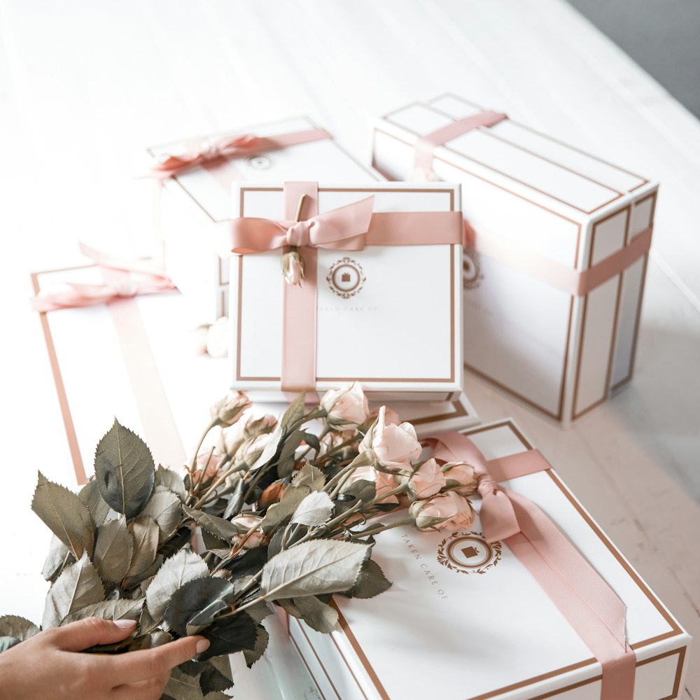 Multiple matching gift boxes styled with roses for bulk gifting